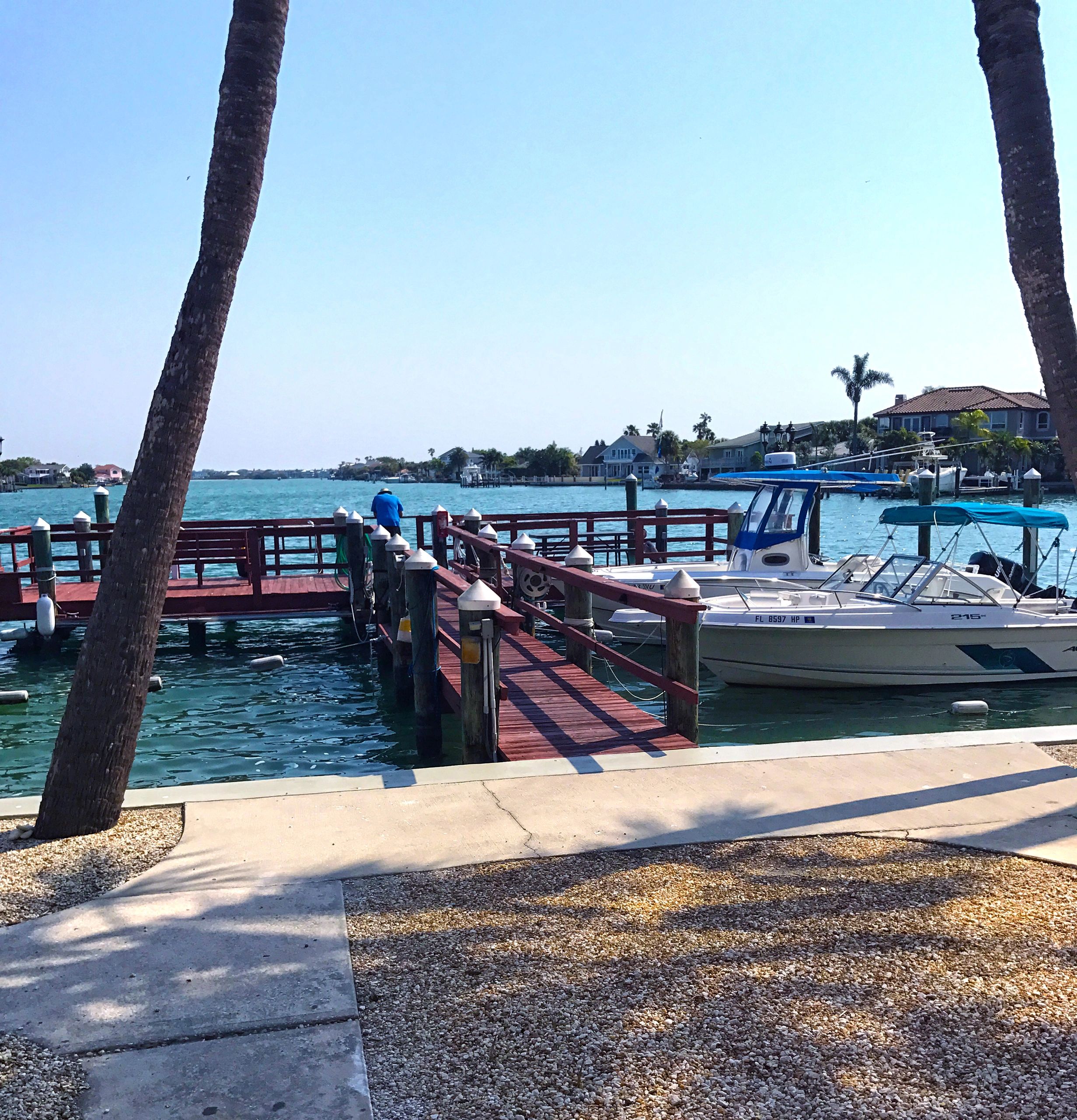 Wooden dock with red railings on the waterfront