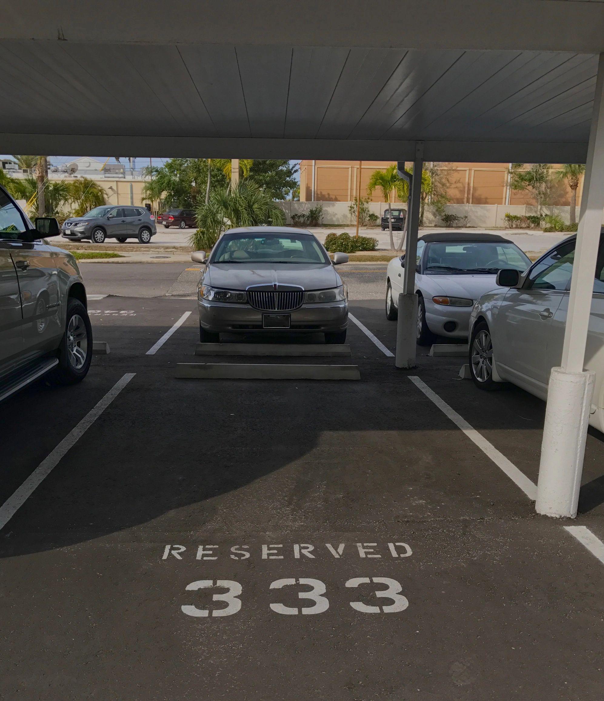 Covered parking garage with reserved spot 333