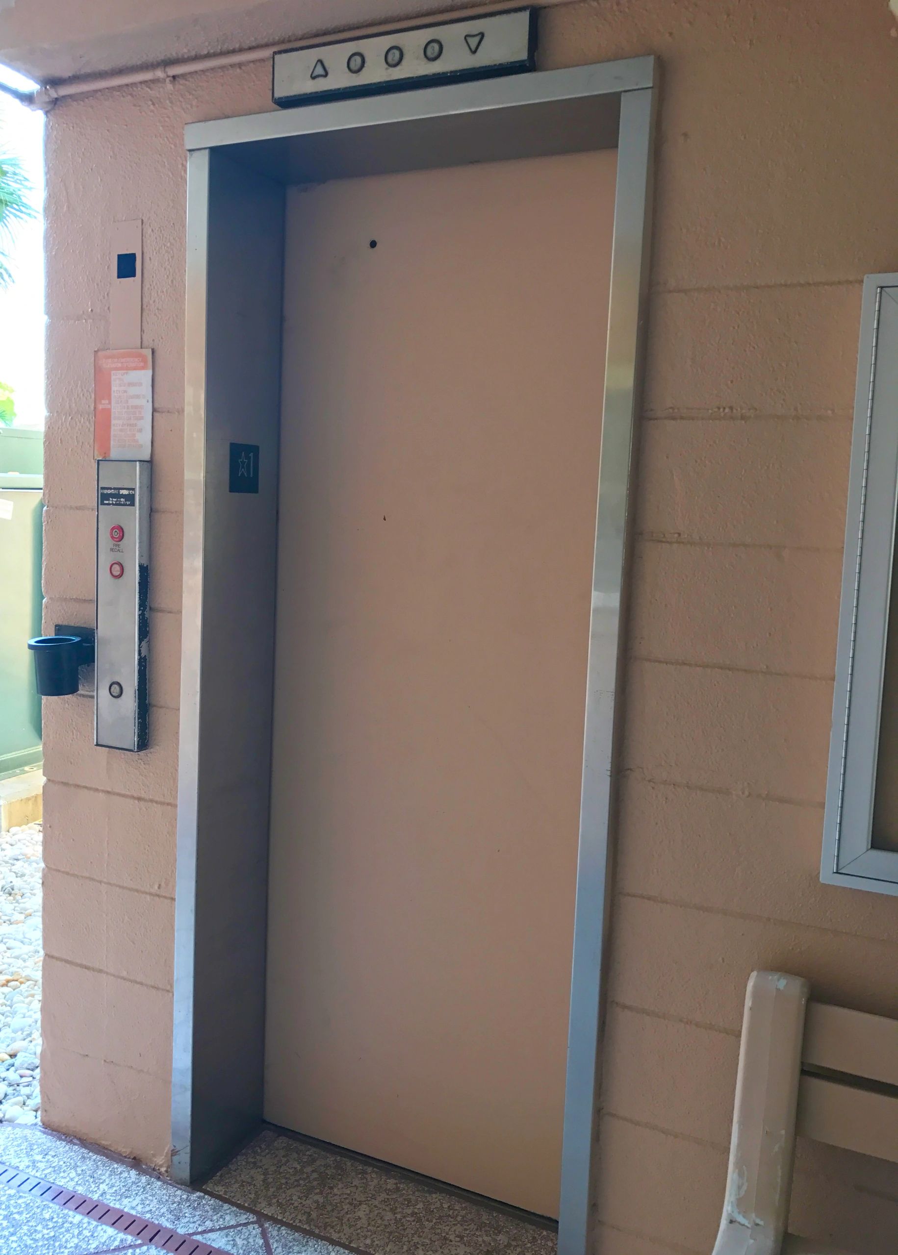 Elevator entrance in building hallway