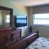 Hotel-style bedroom with white linens