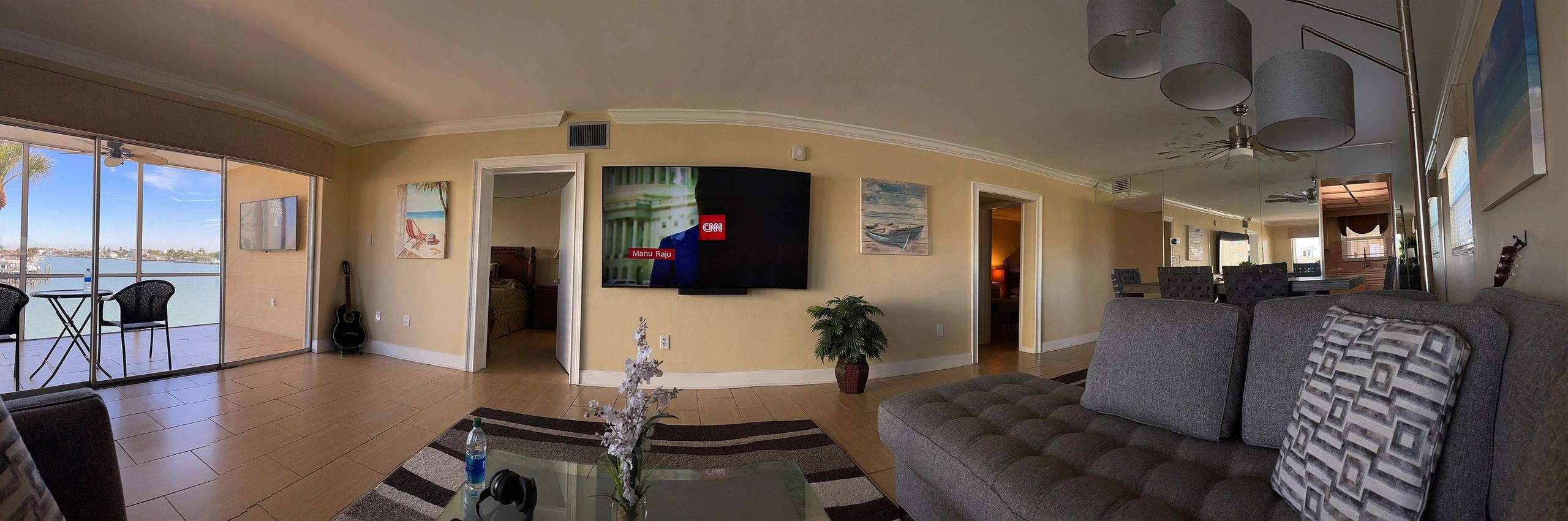 Panoramic condo living room with waterfront views