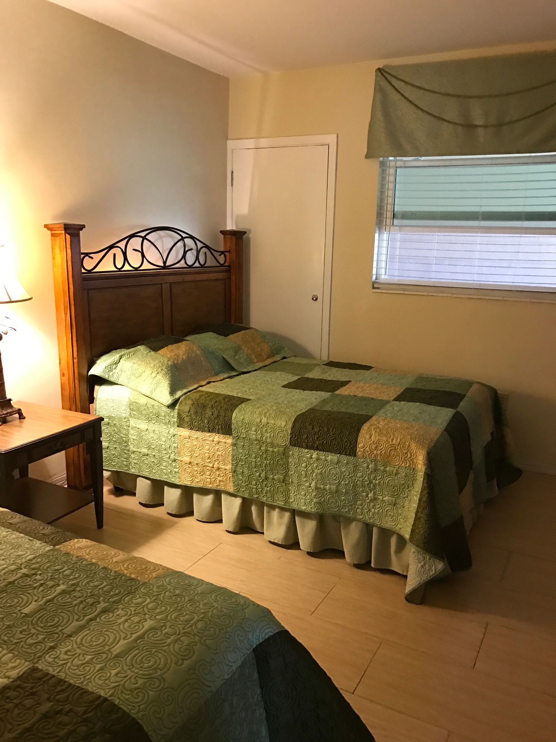 Warm bedroom with ornate metal bed frame