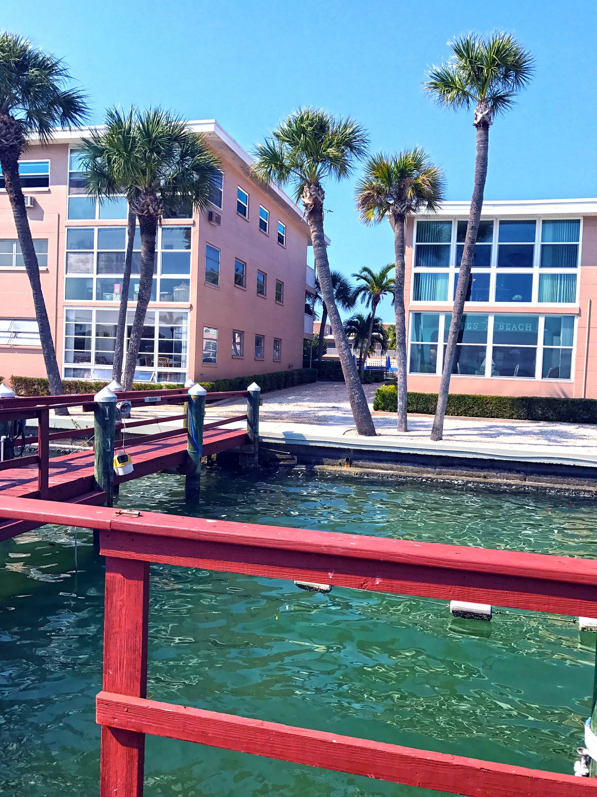 Pastel-colored waterfront buildings and marina
